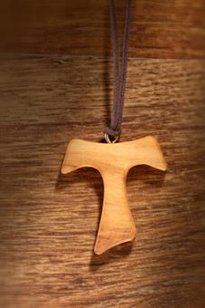 Baptism cross made of olive wood with band made from fabric 